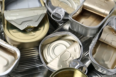 Photo of Many crumpled tin cans as background, closeup