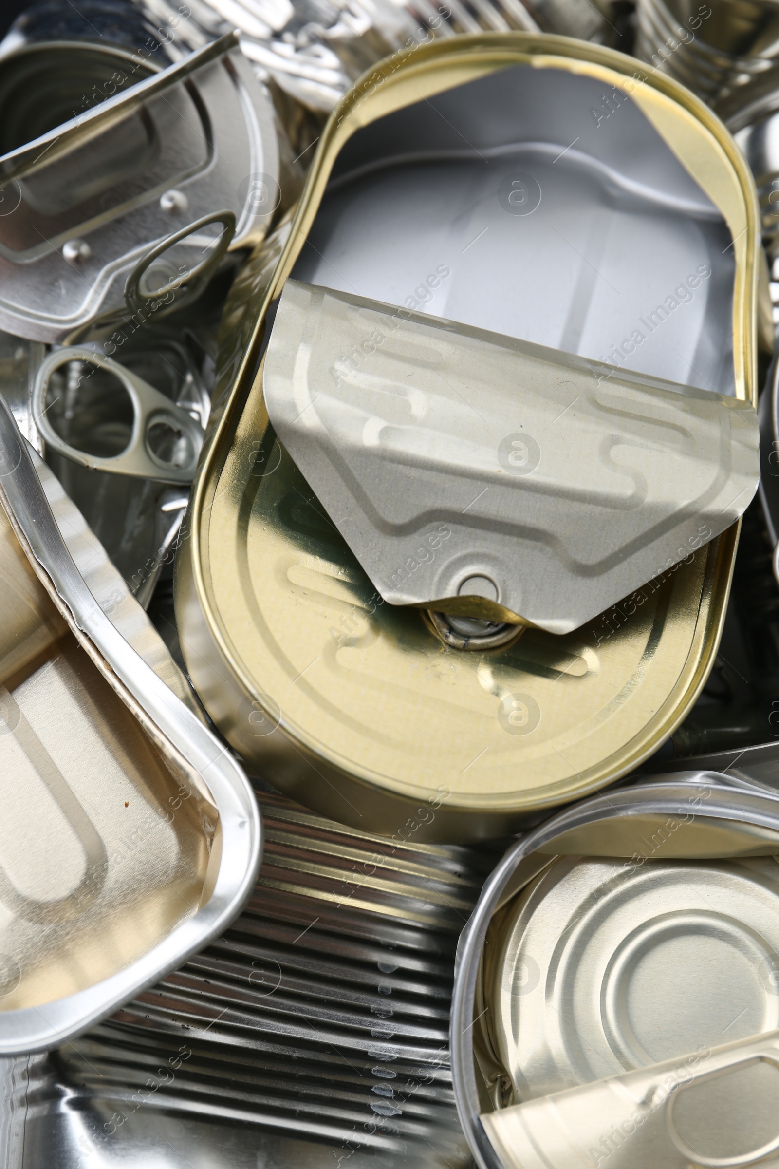 Photo of Many crumpled tin cans as background, closeup