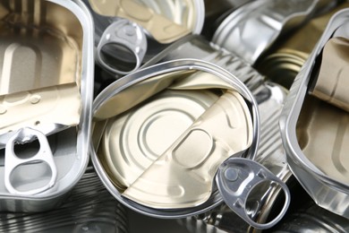 Photo of Many crumpled tin cans as background, closeup