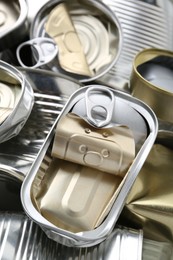 Photo of Many crumpled tin cans as background, closeup