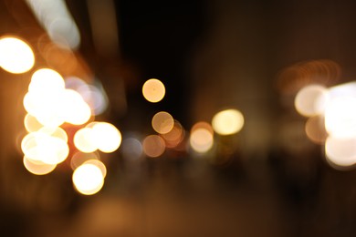 Photo of Blurred view of city street at night. Bokeh effect