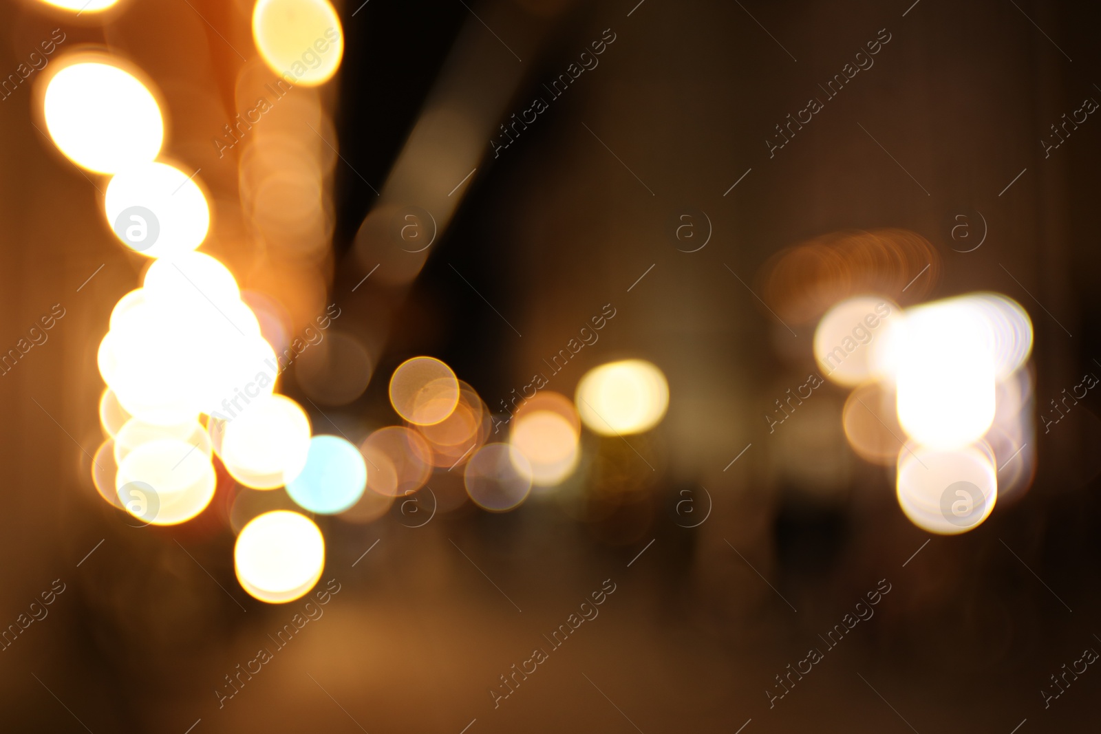 Photo of Blurred view of city street at night. Bokeh effect