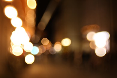 Photo of Blurred view of city street at night. Bokeh effect