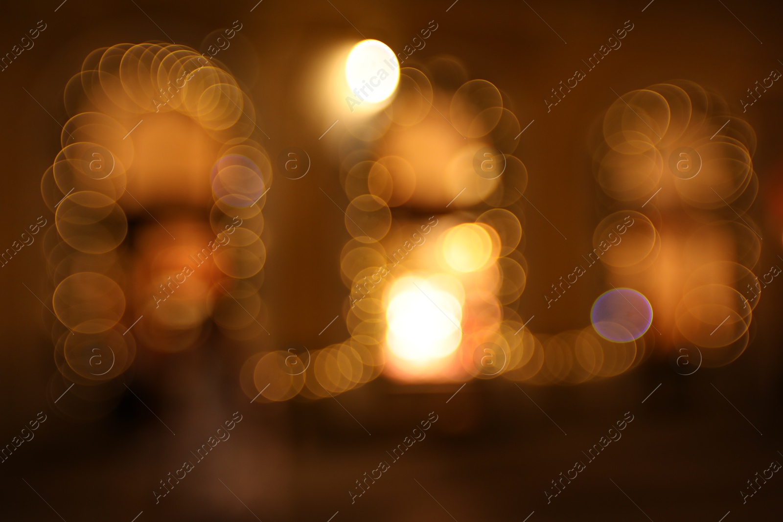 Photo of Blurred view of windows with festive lights, bokeh effect