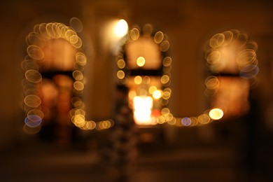 Photo of Blurred view of windows with festive lights, bokeh effect