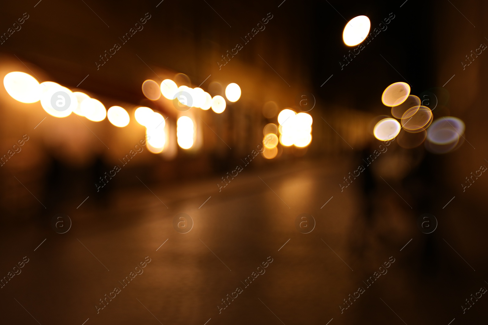 Photo of Blurred view of city street at night. Bokeh effect