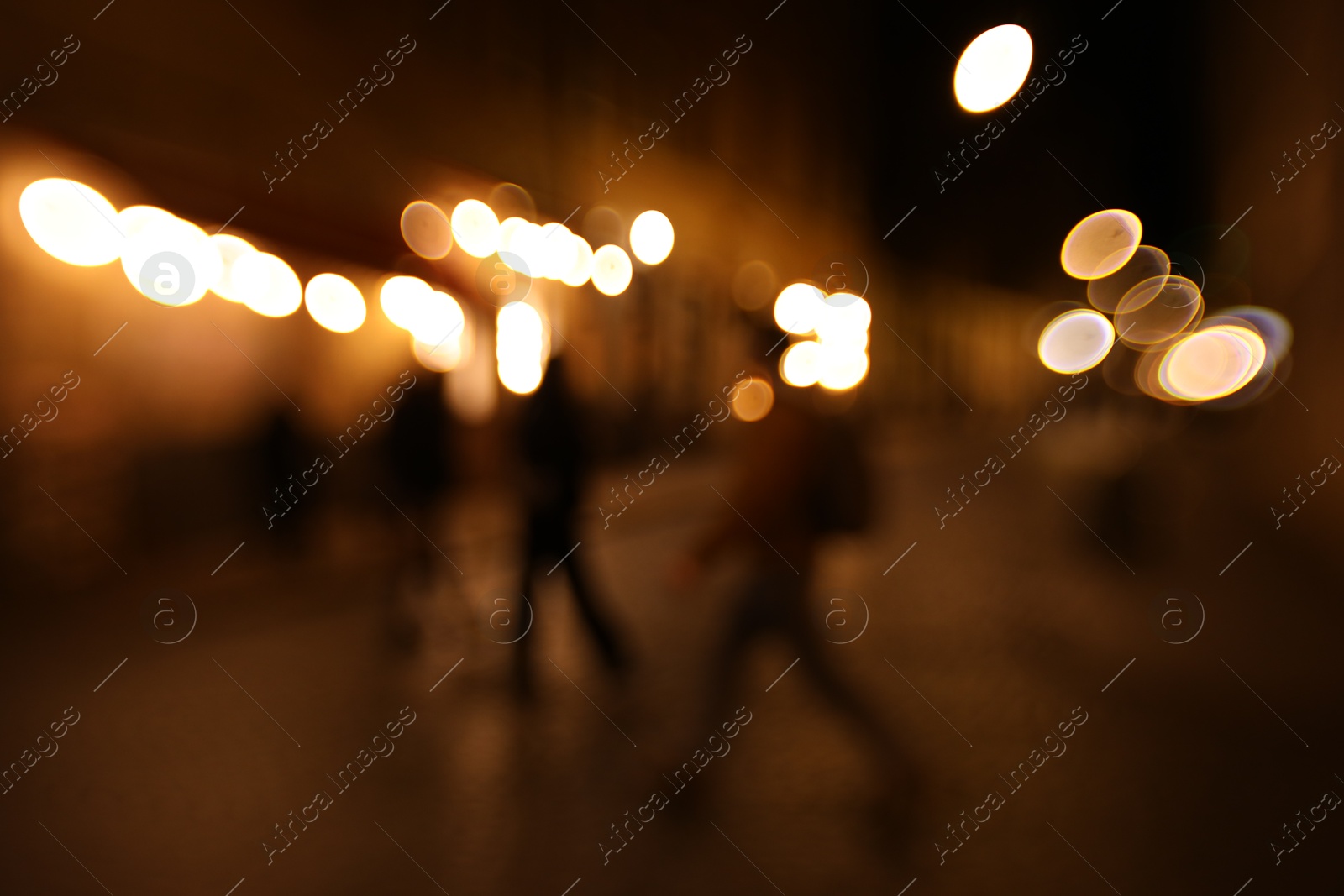 Photo of Blurred view of city street at night. Bokeh effect