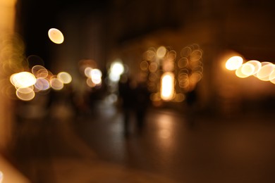 Photo of Blurred view of city street at night. Bokeh effect