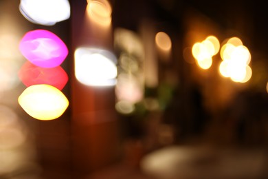 Photo of Blurred view of city street at night. Bokeh effect