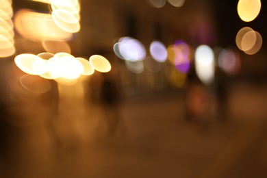 Photo of Blurred view of city street at night. Bokeh effect