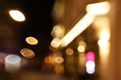 Photo of Blurred view of city street at night. Bokeh effect