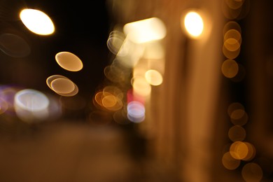 Photo of Blurred view of city street at night. Bokeh effect