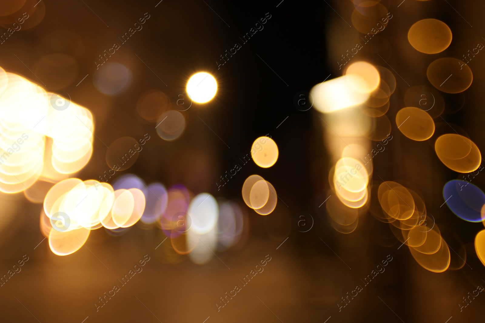 Photo of Blurred view of city street at night. Bokeh effect