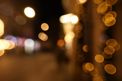 Photo of Blurred view of city street at night. Bokeh effect