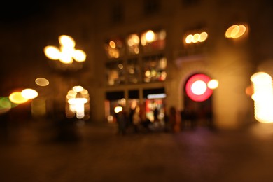 Photo of Blurred view of city street at night. Bokeh effect