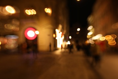 Photo of Blurred view of city street at night. Bokeh effect