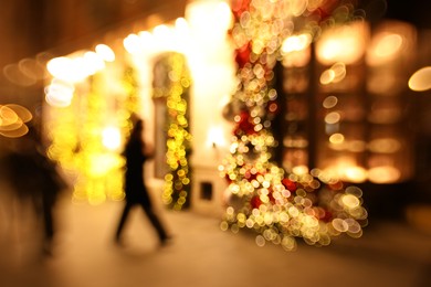 Photo of Defocused view of building with festive lights, bokeh effect