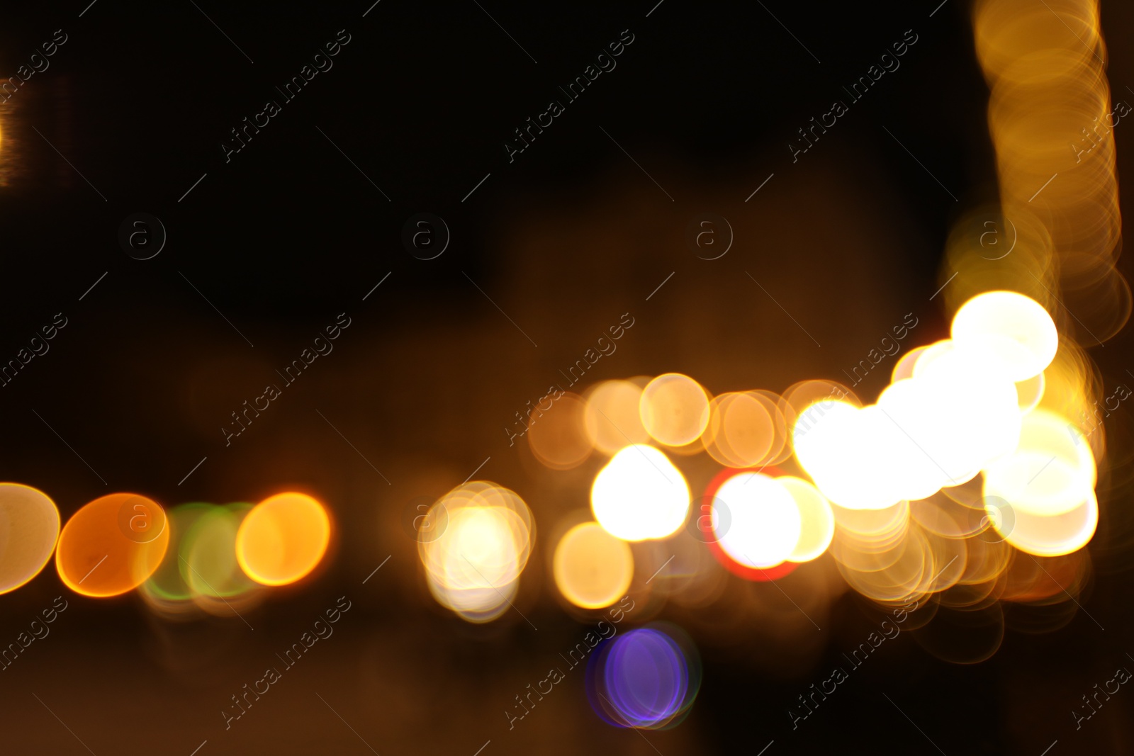 Photo of Blurred view of city street at night. Bokeh effect