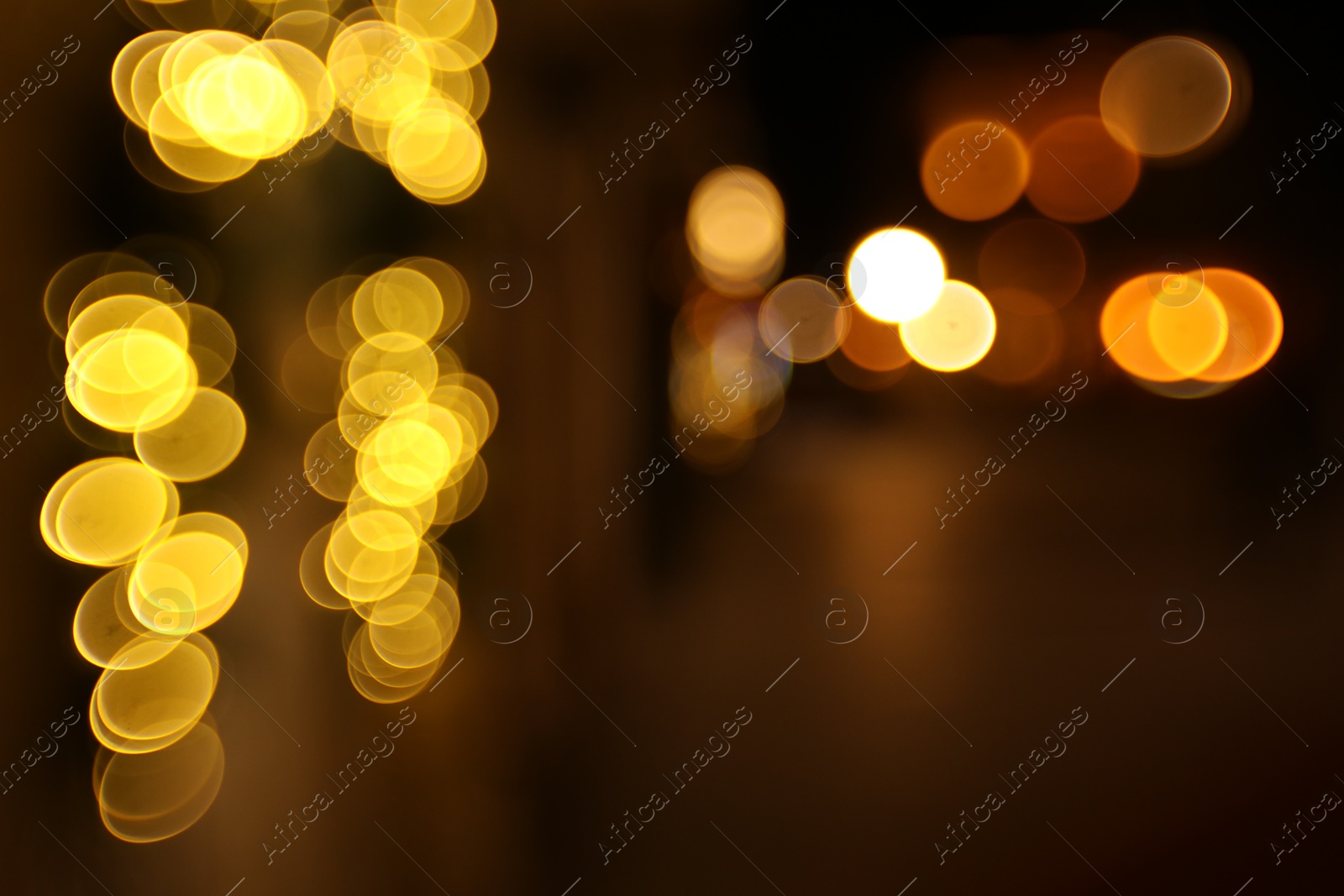 Photo of Blurred view of city street at night. Bokeh effect