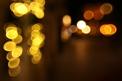 Photo of Blurred view of city street at night. Bokeh effect