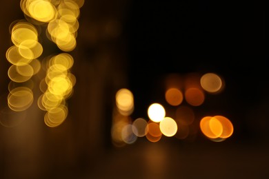 Photo of Blurred view of city street at night. Bokeh effect