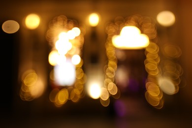 Photo of Blurred view of city street at night. Bokeh effect