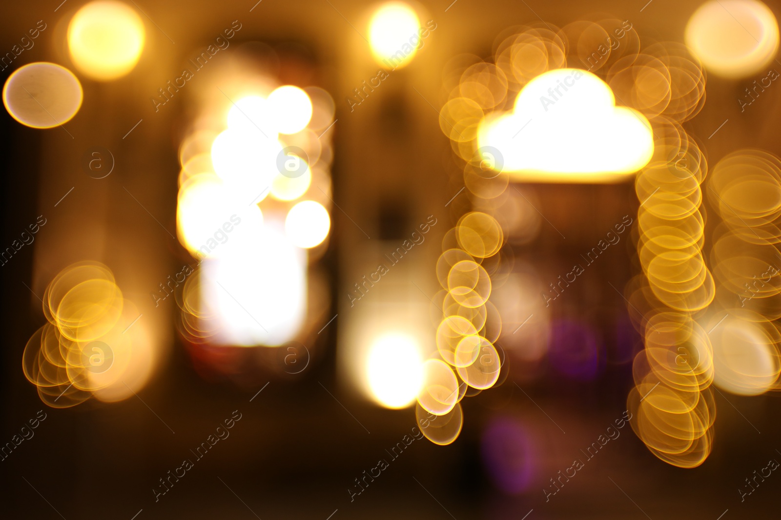 Photo of Blurred view of city street at night. Bokeh effect