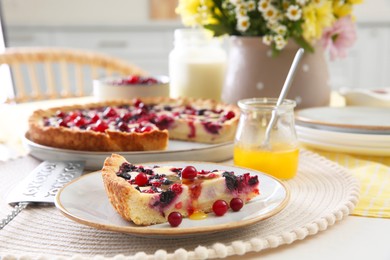 Photo of Piece of delicious currant pie with honey on white table indoors, closeup