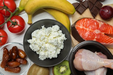 Photo of Different fresh products rich in serotonin on white wooden table, flat lay