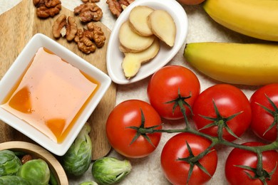 Photo of Different fresh products rich in melatonin on light table, flat lay