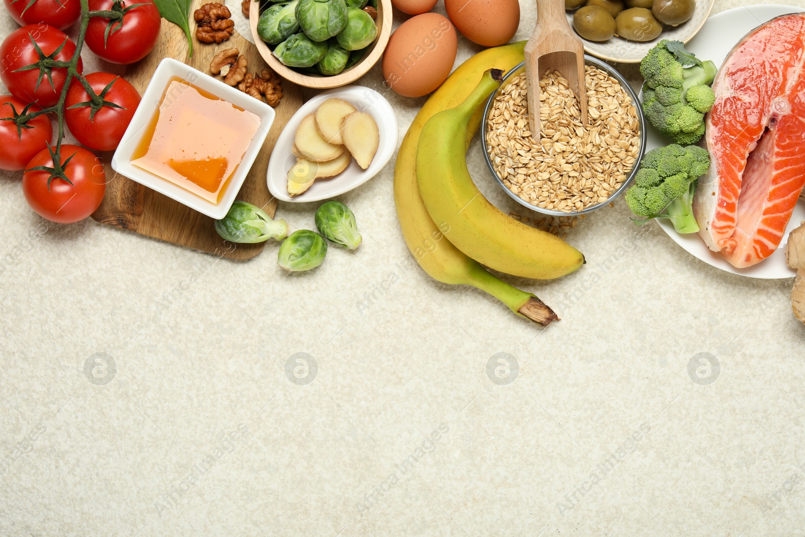 Photo of Different fresh products rich in melatonin on light textured table, flat lay. Space for text