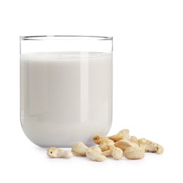 Photo of Fresh cashew milk in glass and nuts isolated on white