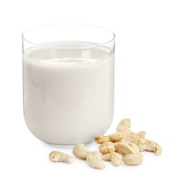 Photo of Fresh cashew milk in glass and nuts isolated on white