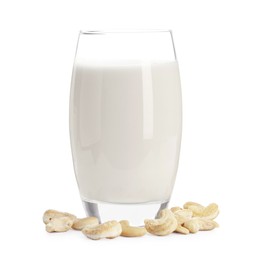 Photo of Fresh cashew milk in glass and nuts isolated on white