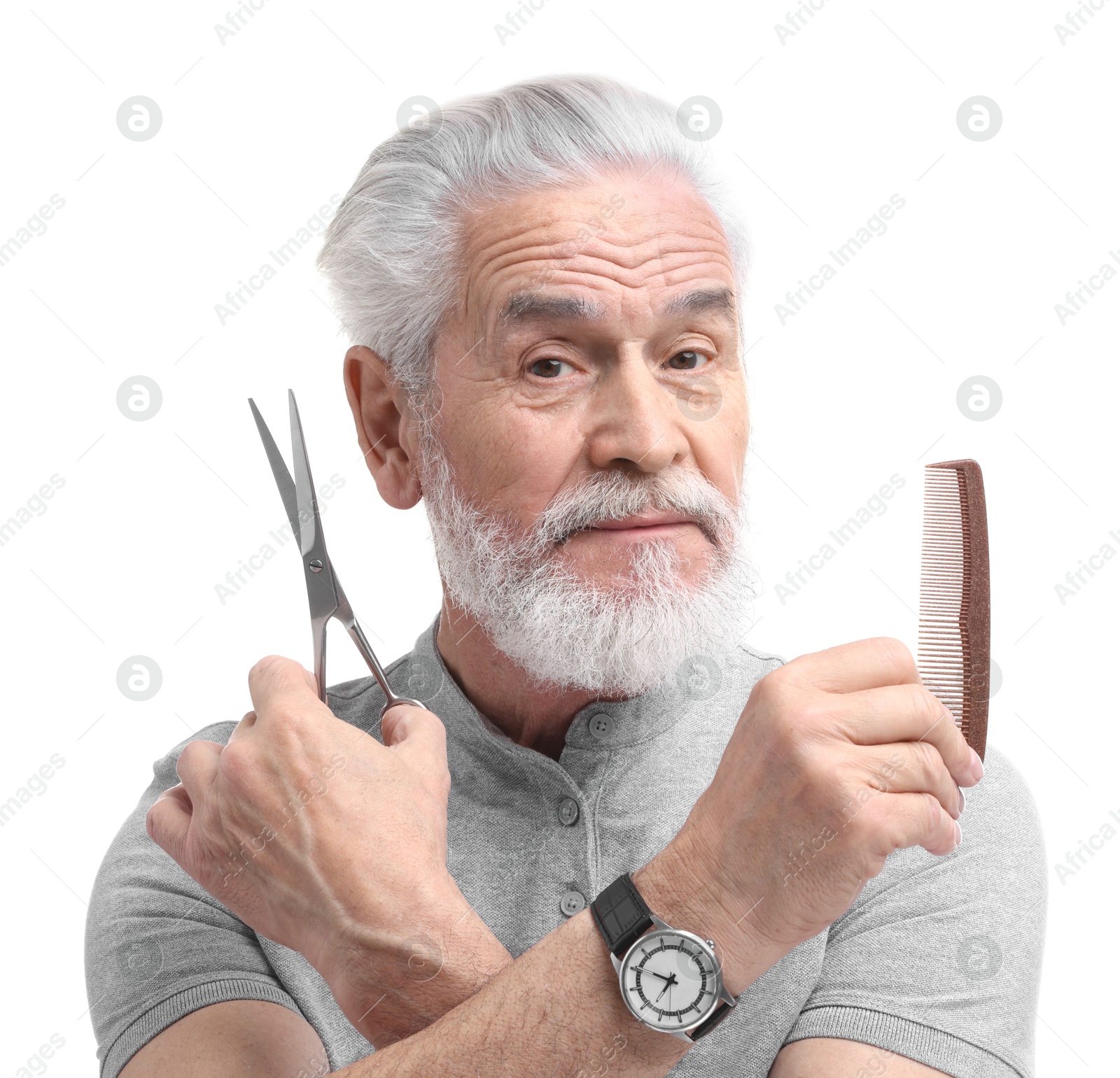 Photo of Bearded senior man with comb and scissors on white background