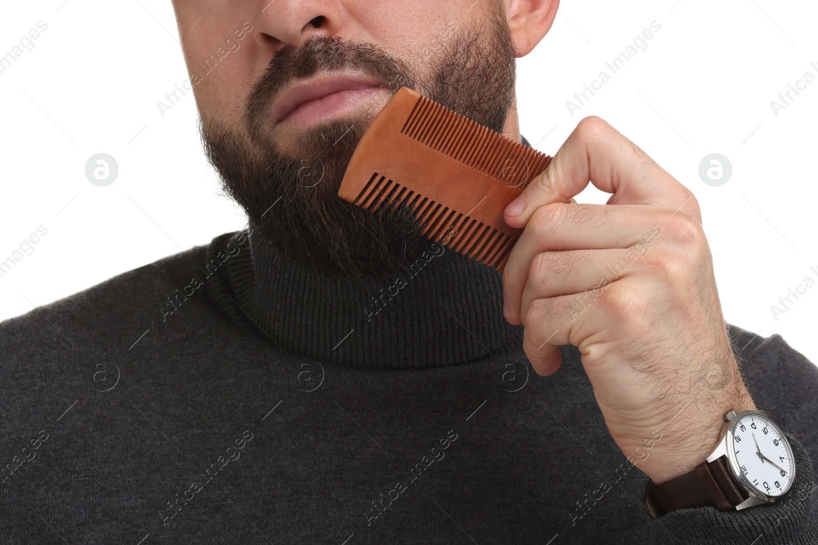 Photo of Man combing beard on white background, closeup