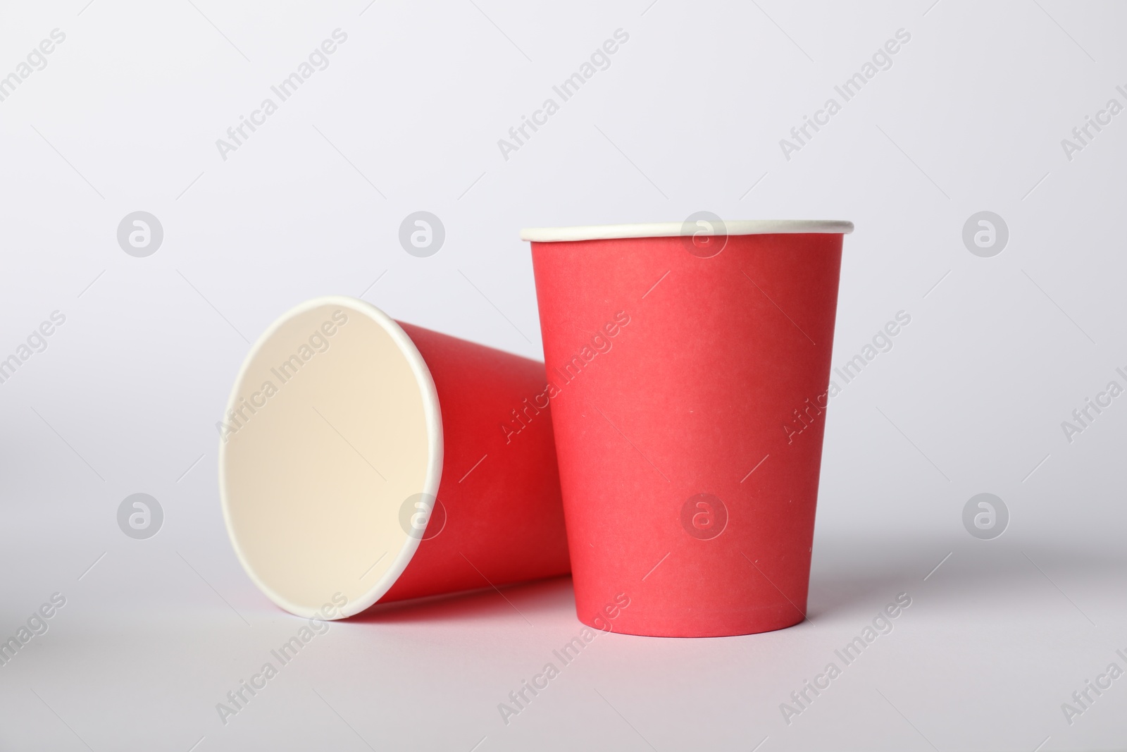 Photo of Paper cups on white background. Mockup for design