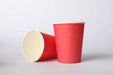 Photo of Paper cups on white background. Mockup for design