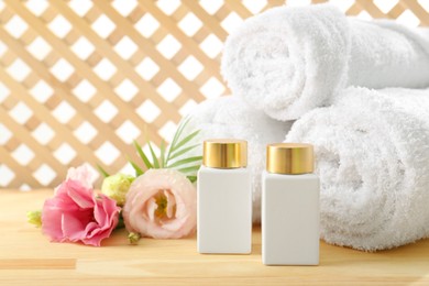 Photo of Composition with cosmetic products for spa treatment on wooden table