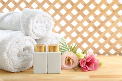 Photo of Composition with cosmetic products for spa treatment on wooden table