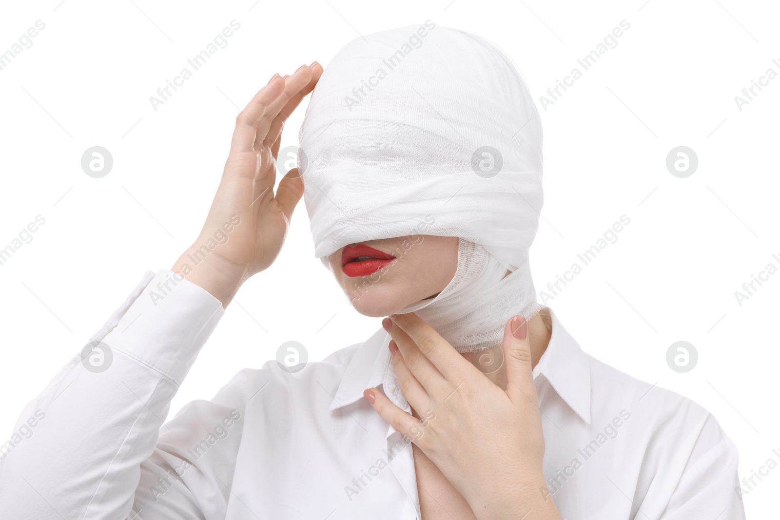 Photo of Woman with face wrapped in medical bandage after plastic surgery operation on white background