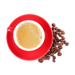 Photo of Red cup of aromatic coffee, saucer and beans isolated on white, top view