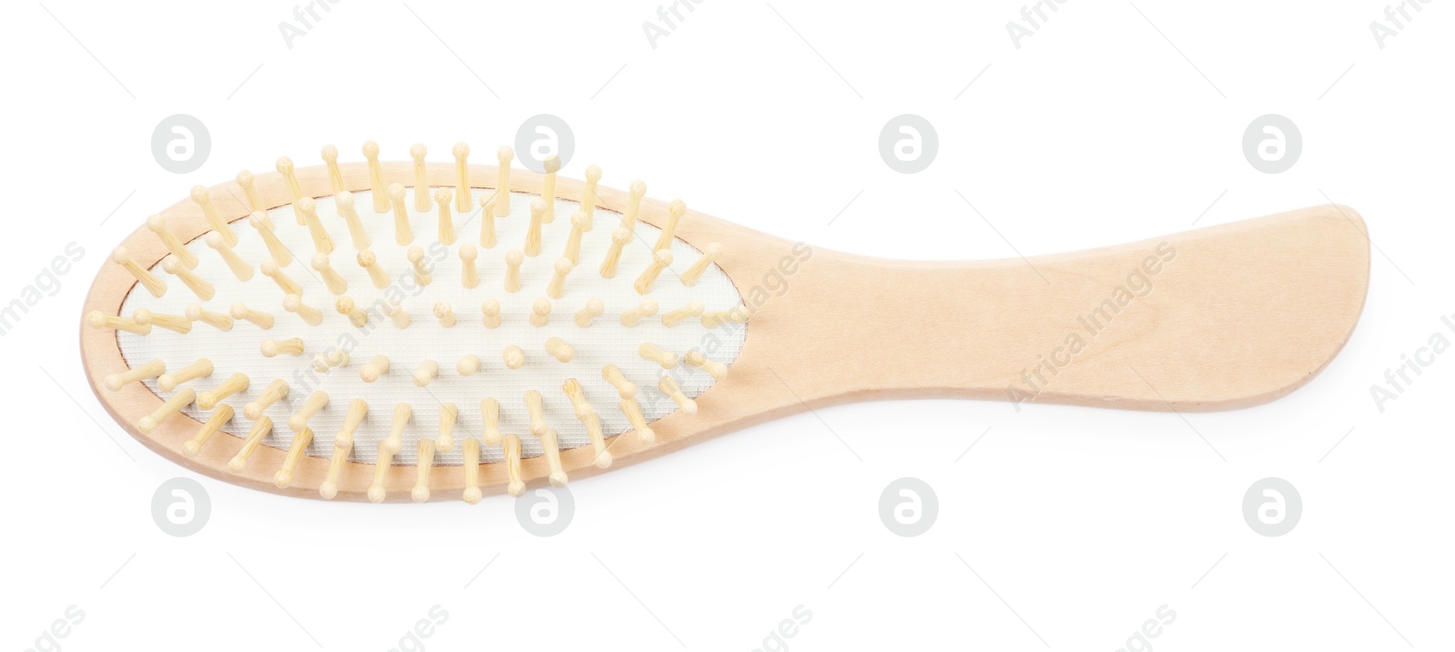 Photo of New wooden hair brush isolated on white, top view