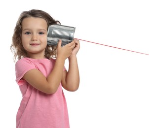 Photo of Girl using tin can telephone on white background