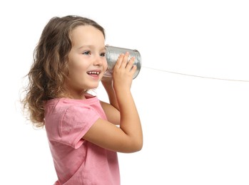 Photo of Girl using tin can telephone on white background