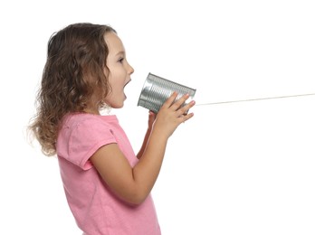 Photo of Girl using tin can telephone on white background