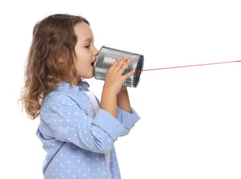 Photo of Girl using tin can telephone on white background