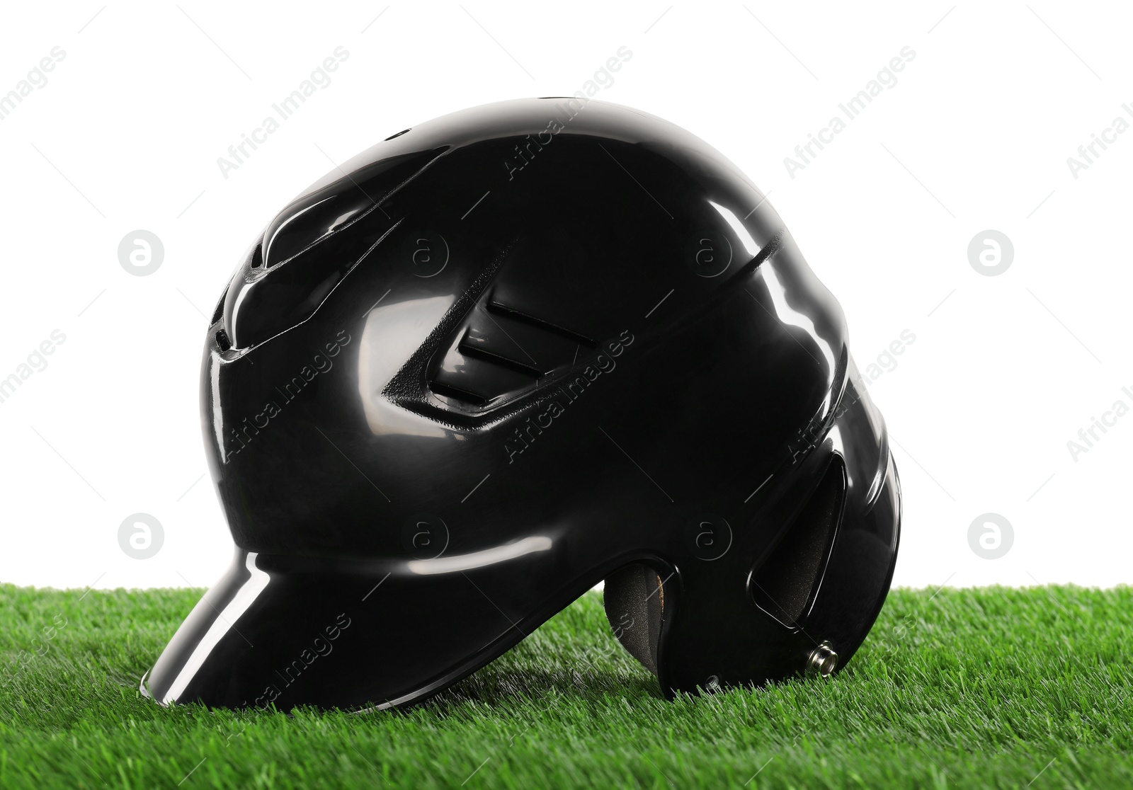 Photo of Protective helmet on artificial grass isolated on white. Sport equipment