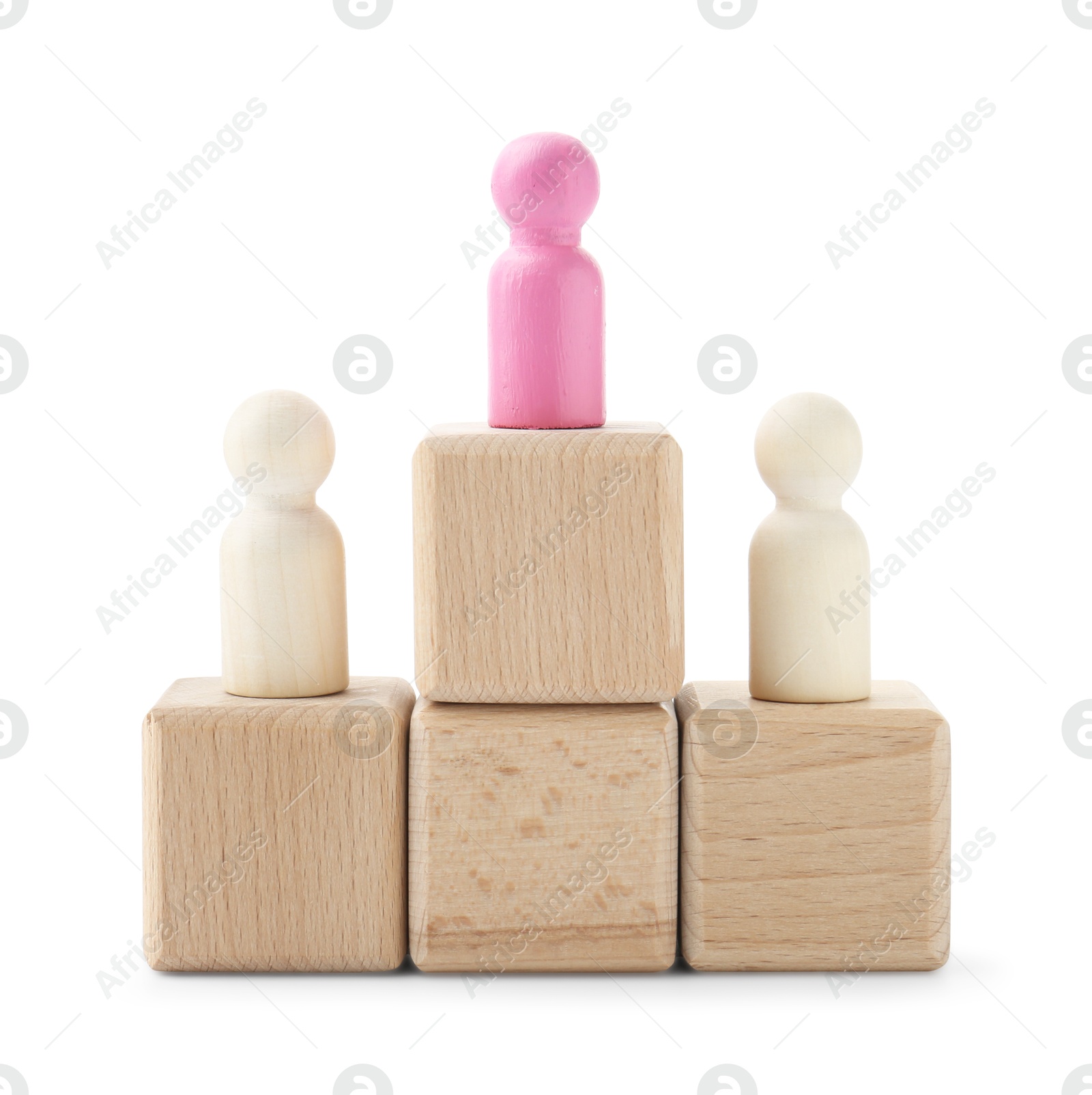 Photo of Human figures on wooden blocks, pink one on top against white background. Competition concept