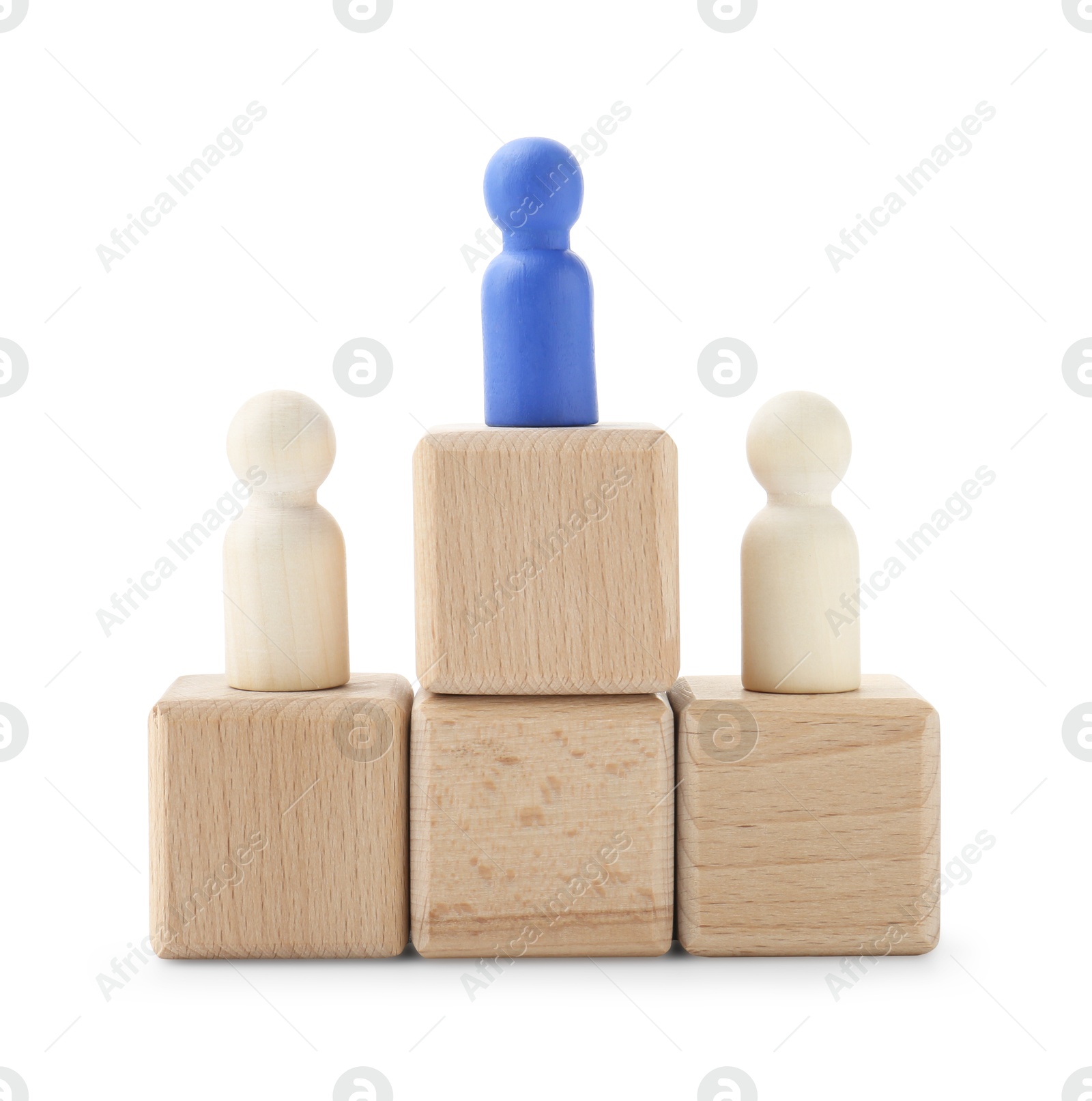 Photo of Human figures on wooden blocks, blue one on top against white background. Competition concept